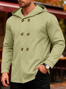 Detail of light olive men's slim double-breasted trench coat with hood and twill texture