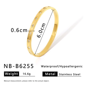 Detail of 18K gold plated stainless steel bangle with white zircon inlays and dimensions
