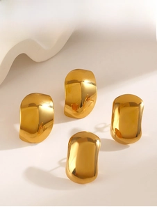 Detail of irregular wave oval stud earrings with polished gold mirror finish