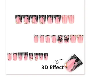 Detailed 3D pink and black leopard print press-on nails with bows and crystals