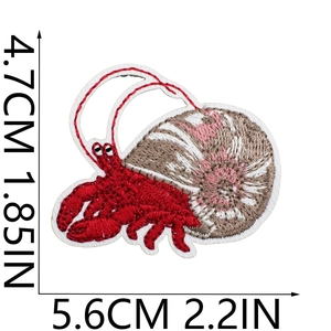 Detail showing red hermit crab embroidered patch dimensions 4.7cm height and 5.6cm width