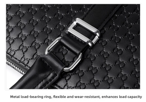 Macro shot of silver metal buckle and embossed leather texture on business briefcase