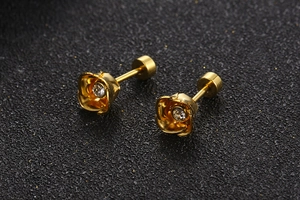 Close-up of gold-plated rose stud earrings with cubic zirconia and screw-back closure