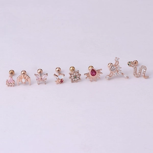Macro view of 8 rose gold surgical steel stud earrings featuring colorful zircon shapes