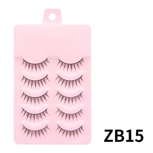 Detail view of 5 pairs of natural curly black false eyelashes in pink tray model ZB15