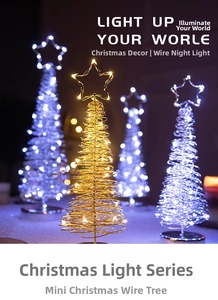 Close-up of golden iron wire mini Christmas tree with warm white LED lights and star topper