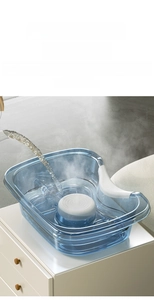 Detail of ergonomic blue shampoo basin showing heat-resistant PP material and neck support