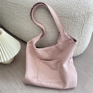 Detail view of pink faux suede hobo bag with trendy purple leopard print inner lining