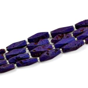 Detailed view of octagon dark purple agate beads with golden pyrite inclusions