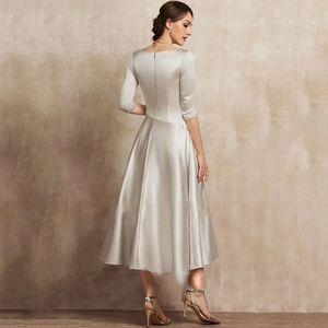 Elegant silver satin midi evening dress with V-neck and mid-length sleeves shown from the back