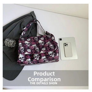 Detail of purple nylon tote featuring gothic skull and rose patterns with wide strap