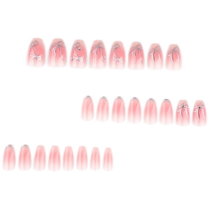 Pink ombre press-on nails with silver bow designs and rhinestones in coffin shape