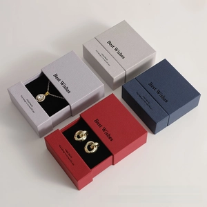 Detailed view of premium drawer-style jewelry boxes in four elegant textured colors
