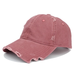 Distressed vintage style cotton baseball cap with ripped details and street fashion look
