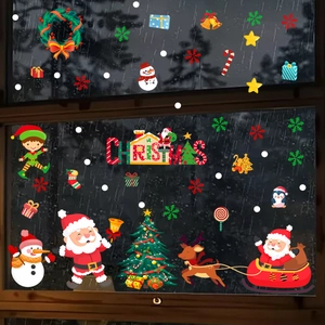 Detailed Christmas window stickers with Santa, reindeer and snowman on glass pane
