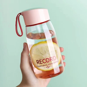 Minimalist portable clear plastic water bottle with pink lid and silicone carrying strap
