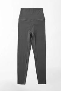 Close-up of dark grey high-waisted yoga leggings with seamless stitching and elastic fabric