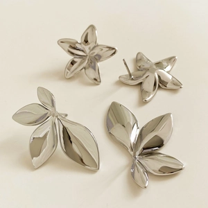 Polished silver stainless steel leaf and flower earrings with a minimalist summer design
