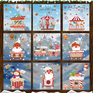 Detail view of festive Santa, snowman, and carousel static window decals on glass