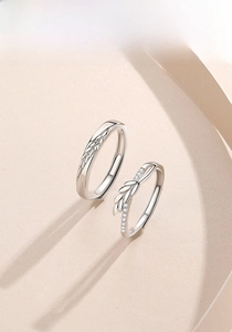 Detail of silver S925 leaf rings with zircon inlay and adjustable open band design