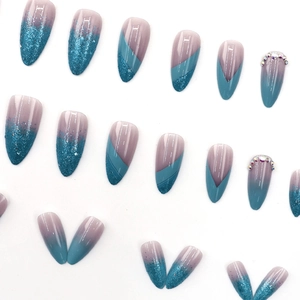 Blue and purple gradient almond press-on nails with glitter and rhinestone accents
