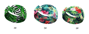 Three knotted yoga headbands with tropical patterns in green, pink and red colors