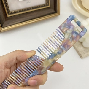 Rainbow marble acetate hair comb with wide teeth and top hanging hole for easy storage
