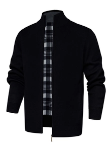 Detail of men's black knit cardigan featuring a warm black and white checkered fleece lining