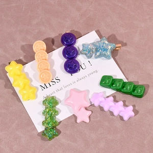 Colorful resin star hair clips with glitter on white cards for girls' accessories