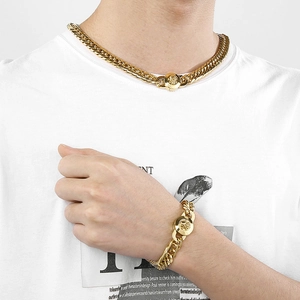 Golden Cuban link necklace and bracelet set featuring detailed 3D lion head buckle