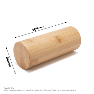 Detail view of cylindrical bamboo sunglasses case with natural wood grain texture