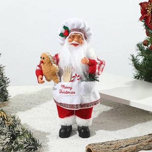 Detail of chef Santa figure with red checkered shirt and Merry Christmas apron