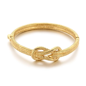 Gold snake chain bangle featuring a central knotted design and a secure buckle clasp