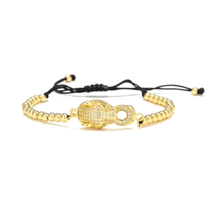 Detail of 18K gold plated leopard head bracelet with sparkling pave crystals