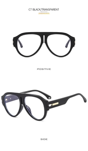 Detail of pilot-style black frame glasses with transparent lenses and gold metal hinges