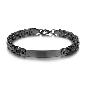Macro detail of industrial black Byzantine chain bracelet with flat ID bar on white background