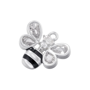 Macro shot of silver bee charm featuring black enamel stripes and cubic zirconia stones