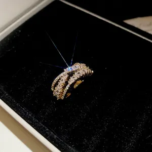 Luxurious gold wide ring with triple layered rows of sparkling square-cut zircons