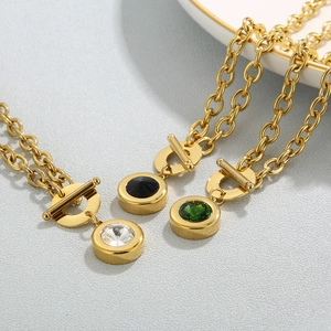 Detail of OT toggle clasp necklace with gold chunky chain and colorful stone charms