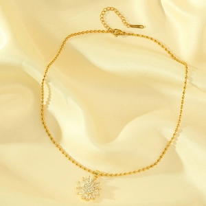 Golden sunflower necklace with sparkling crystals on silky fabric, stainless steel jewelry