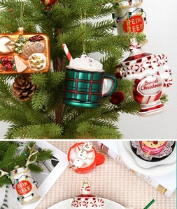 Detailed close-up of glass Christmas tree ornaments featuring festive food and drink shapes