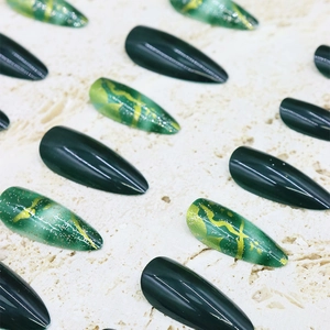 Elegant emerald green and gold foil marble press-on nails in long almond shape