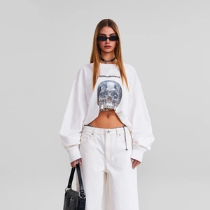 White long-sleeve cotton T-shirt featuring classic skull graphic and brand logo