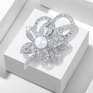 Elegant silver flower brooch with sparkling rhinestones and a large white pearl center