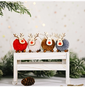 Set of four plush and wooden Christmas reindeer ornaments in red, white, brown and grey