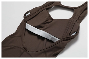 Detail of dark brown jumpsuit featuring built-in padded cups and elastic chest support band