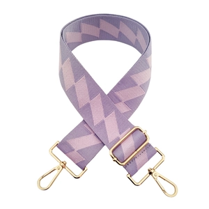 Close-up of adjustable purple and pink geometric pattern fabric strap with gold clips