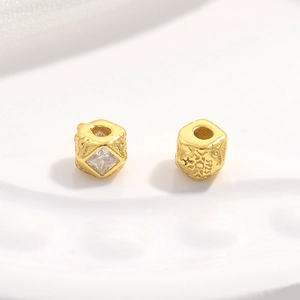 Close-up of S925 sterling silver gold-plated spacer beads with square zircon inlay