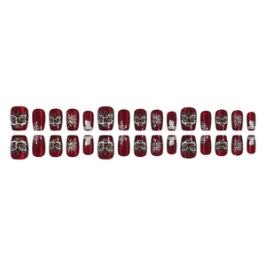 Lion dance and fireworks press-on nails with red cat eye glitter finish and gold 3D decals