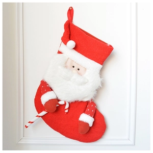 Detail of plush Santa Claus Christmas stocking with 3D beard and striped candy cane charm